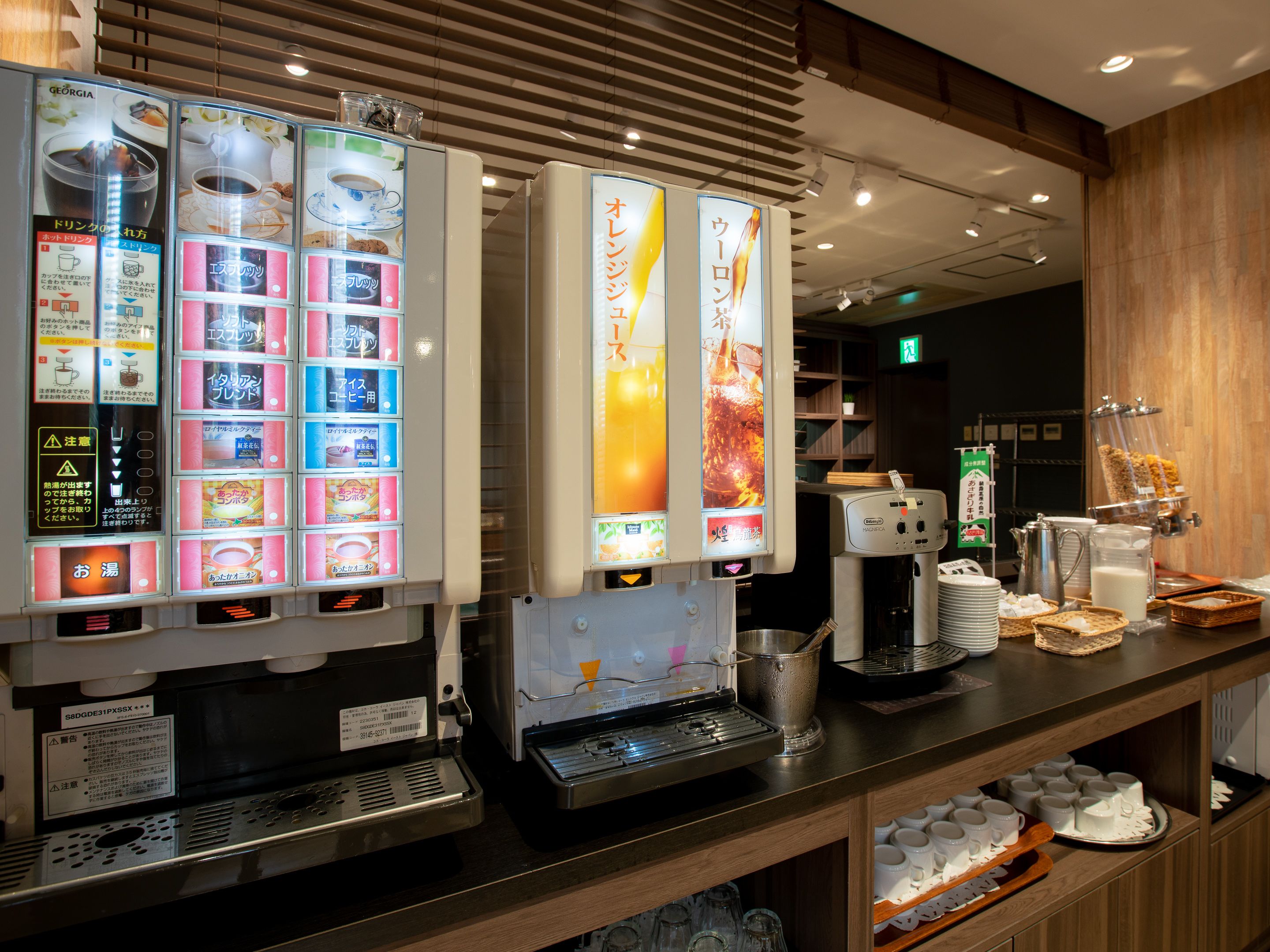 A coffee machine and a beverage dispenser with multiple drink options.