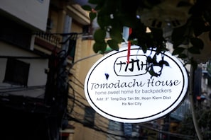 A sign for Tomodachi House, a home sweet home for backpackers, located at Add: 5th Tong Duy Tan Str, Hoan Kiem Dist, Ha Noi City. - Tomodachi House (Hanoi)