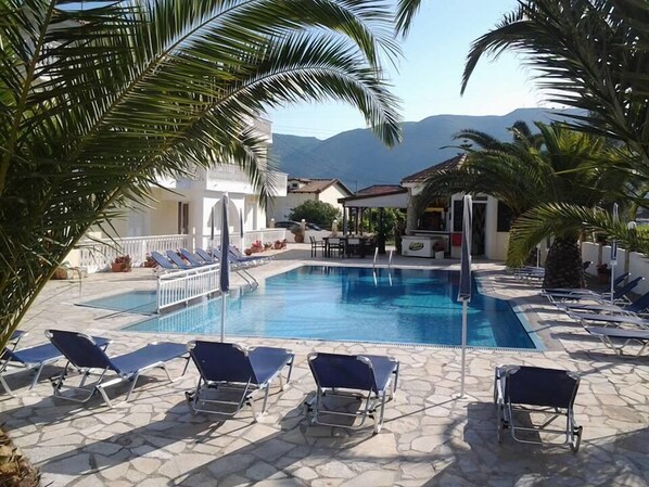 Outdoor pool, pool umbrellas, sun loungers