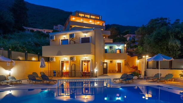 A modern hotel with a swimming pool, outdoor seating, and a multi-story building. - Hotel Corfu Secret (Corfu)