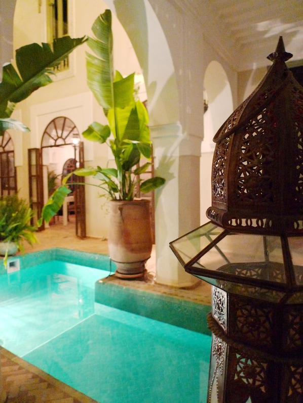 Indoor pool, pool umbrellas, pool loungers