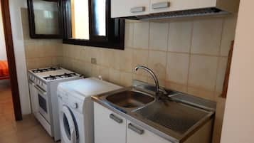 Superior Apartment, 3 Bedrooms, Sea View | Private kitchenette | Full-size fridge, coffee/tea maker