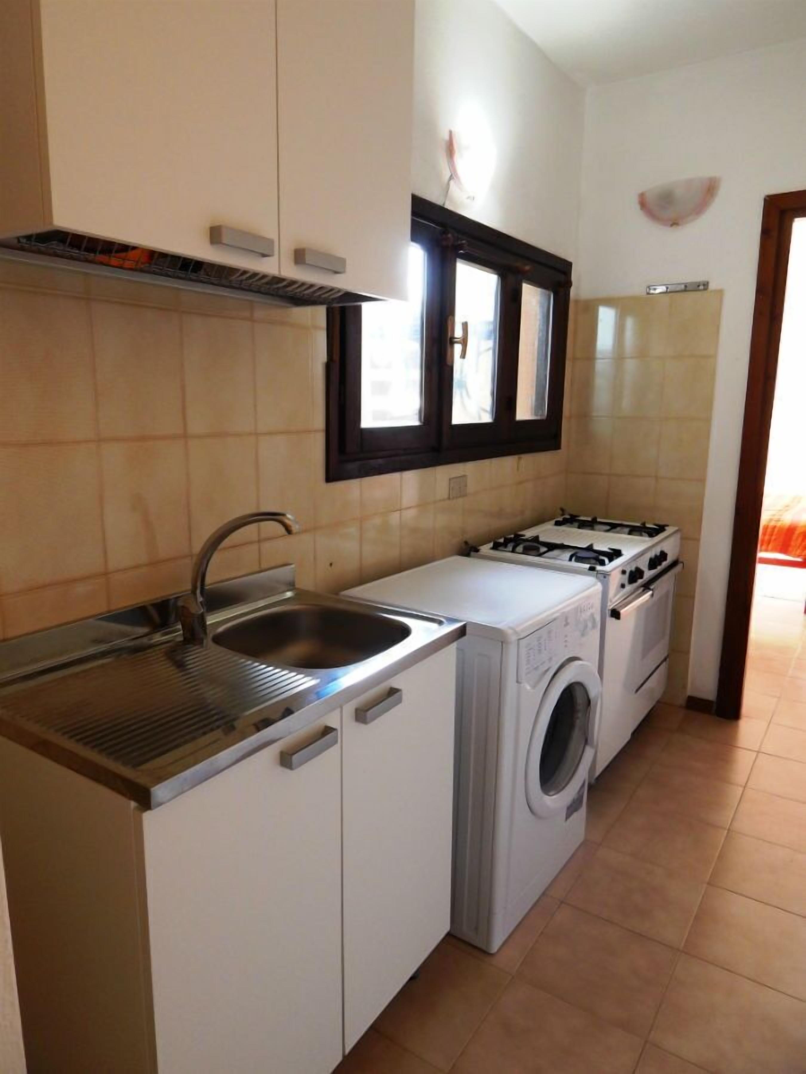Apartment, 3 Bedrooms, Sea View | Private kitchenette | Full-size fridge, coffee/tea maker