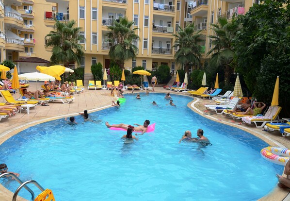 Seasonal outdoor pool, pool umbrellas