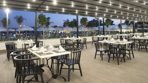 A restaurant with tables and chairs arranged for dining.