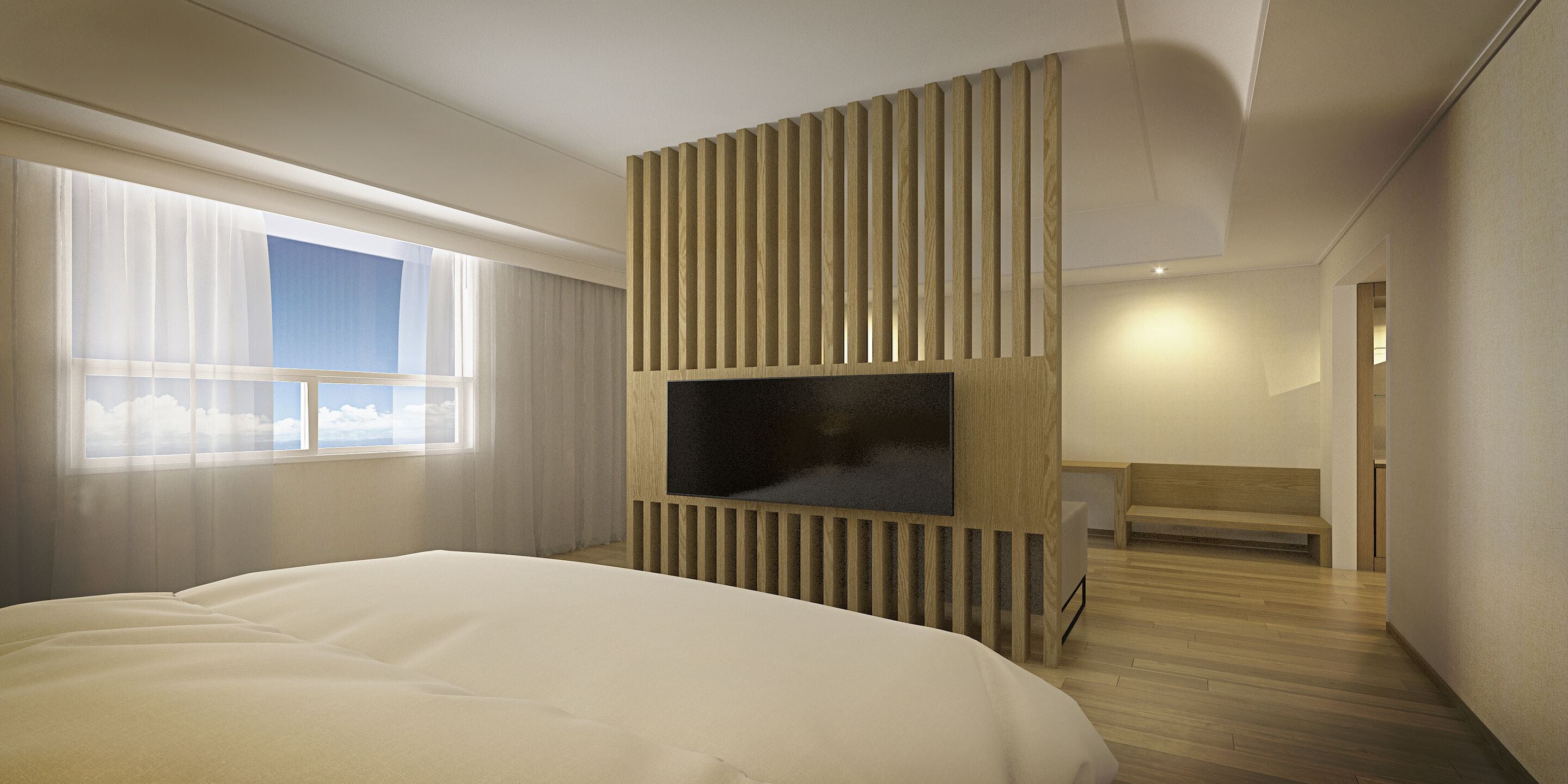 A modern hotel room with a large bed, a TV mounted on a wooden panel, a window with sheer curtains, and a wooden bench.