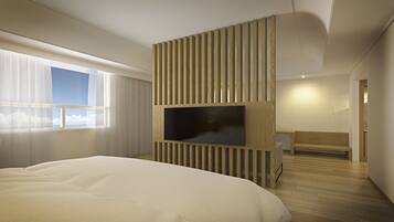 A modern hotel room with a large bed, a TV mounted on a wooden panel, a window with sheer curtains, and a wooden bench.