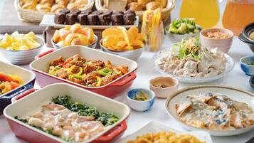 A buffet with various dishes including meats, salads, and pastries.