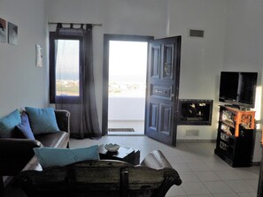 Suite (Volcano) | Living area | 32-inch flat-screen TV with cable channels, TV - Santorini Traditional Suites (Santorini)