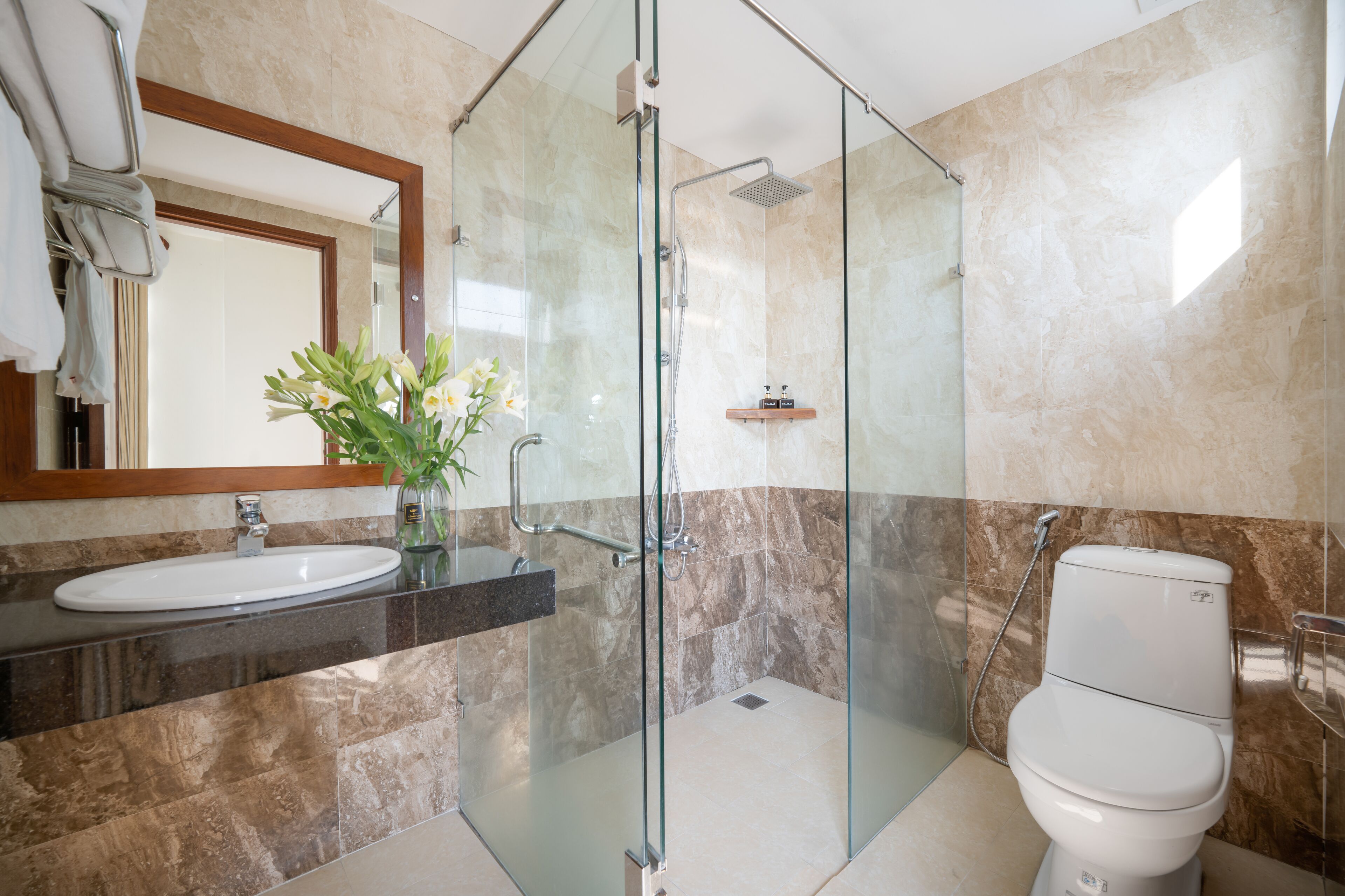 hydromassage showerhead, designer toiletries, hair dryer, slippers