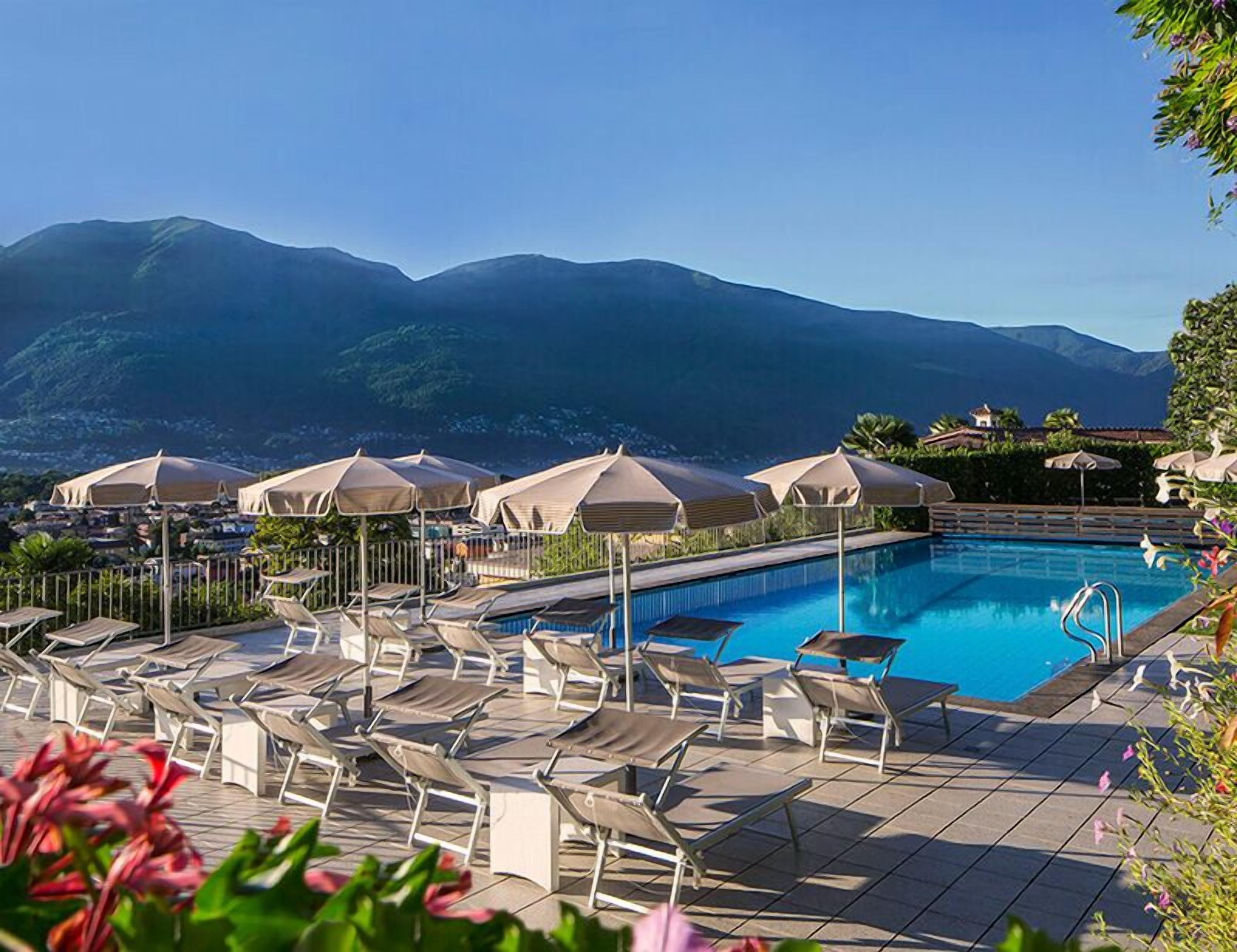 seasonal outdoor pool, open 8:00 am to 6:00 pm, pool umbrellas