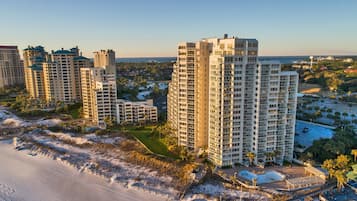On the beach, white sand, beach cabanas, sun-loungers