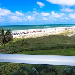 On the beach, white sand, beach cabanas, sun-loungers