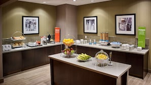 A breakfast buffet with various food items and beverages, including fruits, pastries, and coffee. - Hampton Inn by Hilton Sarnia/Point Edward (Sarnia)