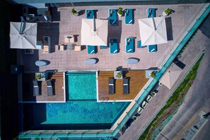 Outdoor pool, open 7:30 AM to 8:30 PM, pool umbrellas, pool loungers