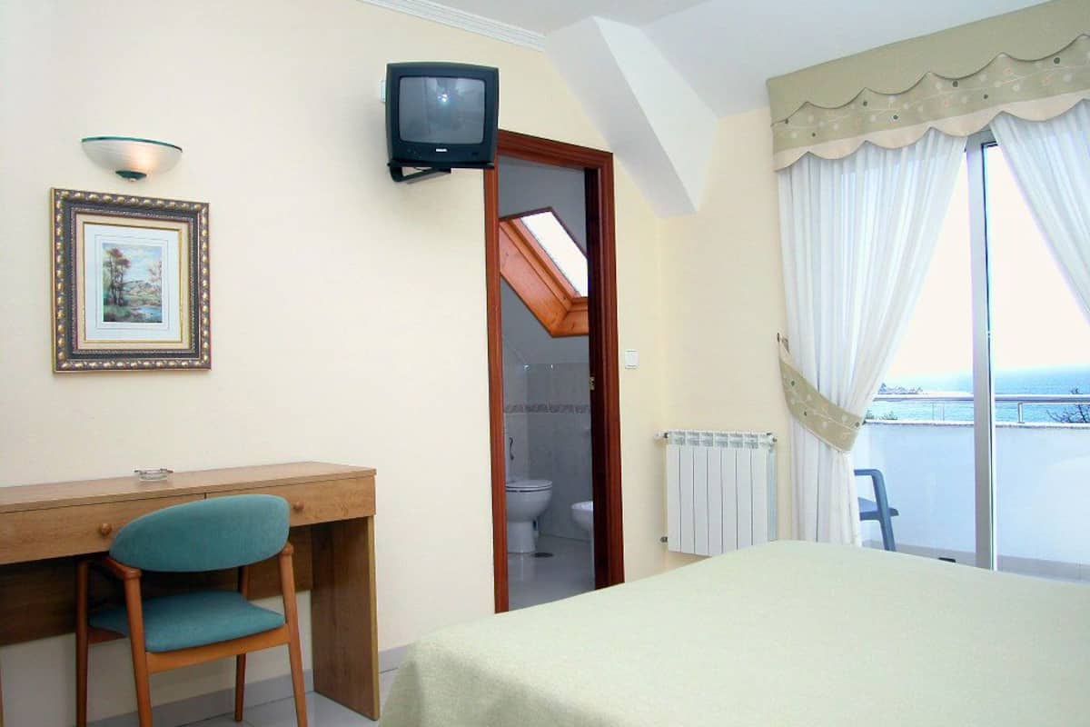 desk, blackout curtains, free cots/infant beds, rollaway beds