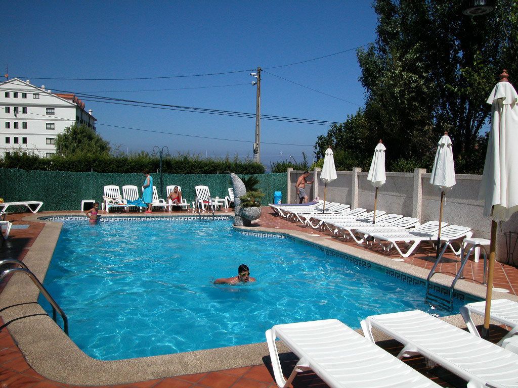 seasonal outdoor pool, pool umbrellas, pool loungers