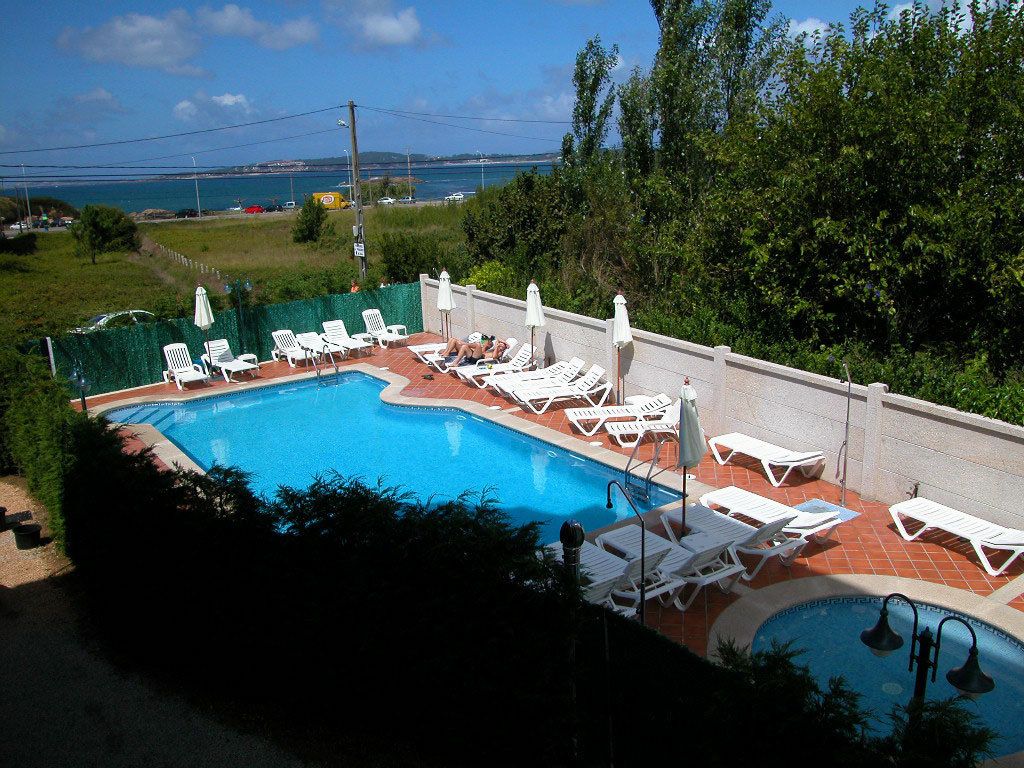 seasonal outdoor pool, pool umbrellas, pool loungers