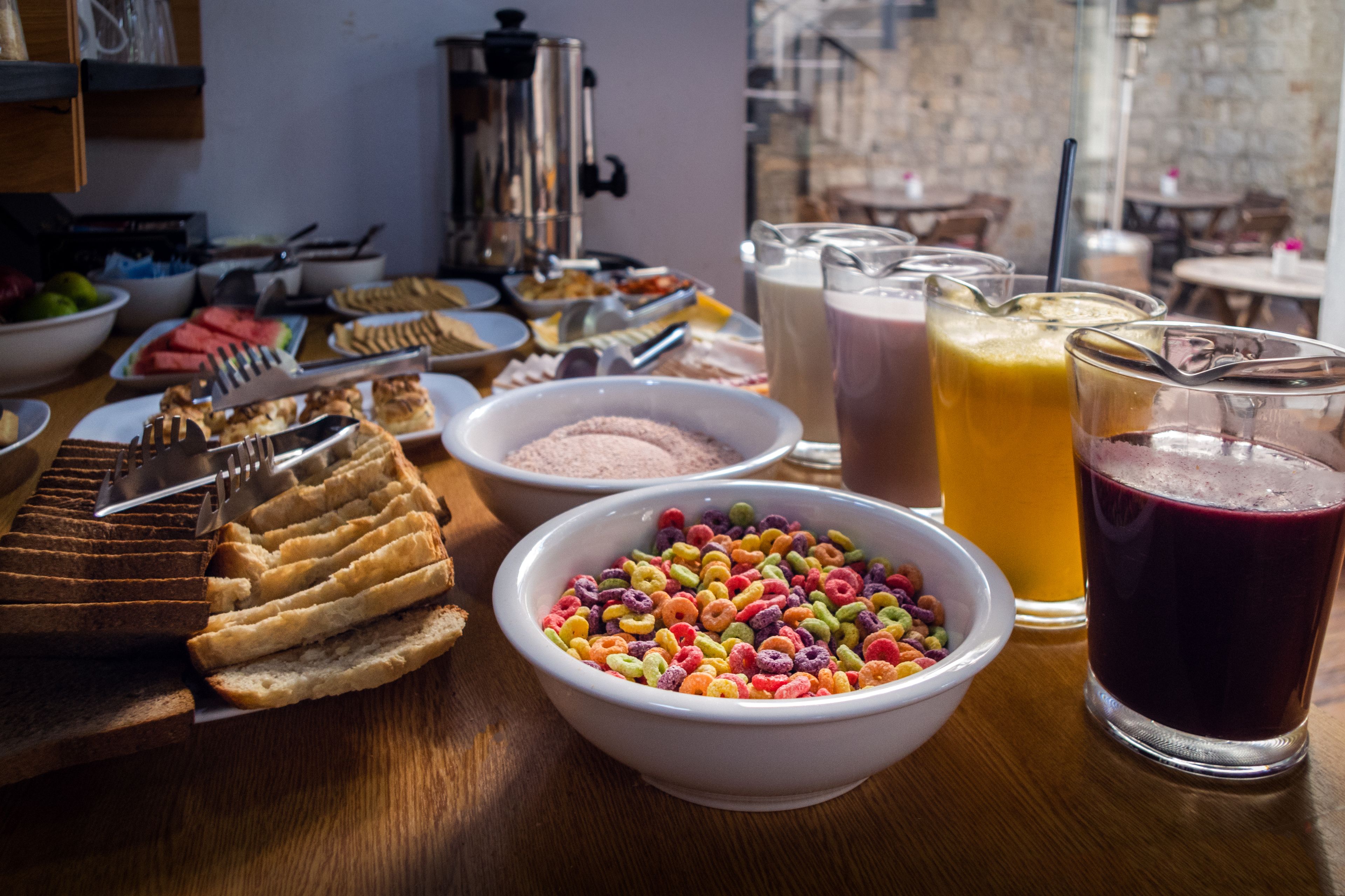 A breakfast buffet with various food items and beverages.