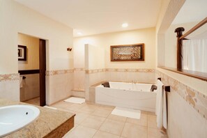 A modern bathroom with a freestanding bathtub, a large sink, and a mirror above the sink. - Baobab Beach Resort (Diani Beach)