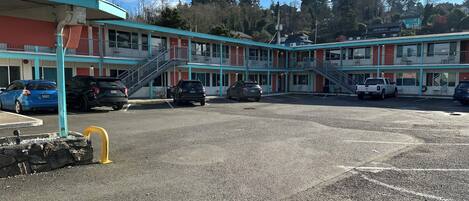 A motel with multiple floors and a parking lot.