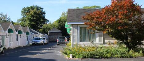 A row of single-story buildings with a central road, likely a motel or small hotel.