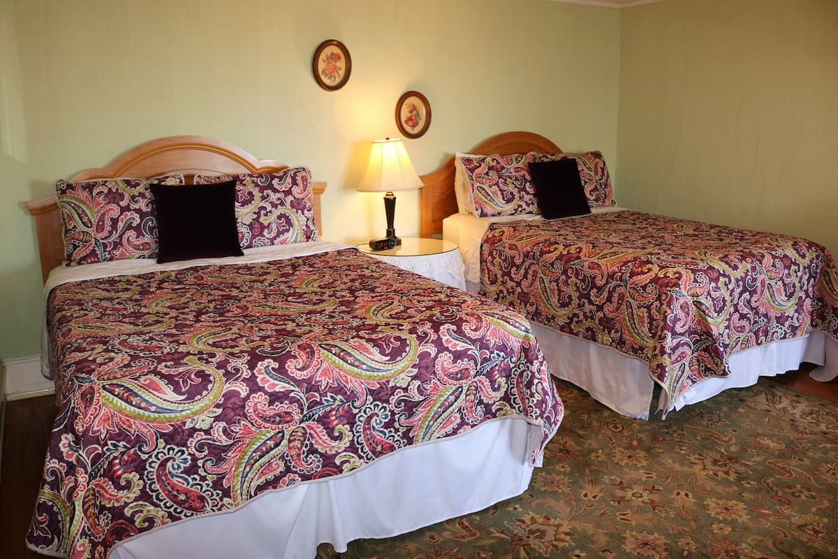 Sage Room | Individually decorated, iron/ironing board, cribs/infant beds