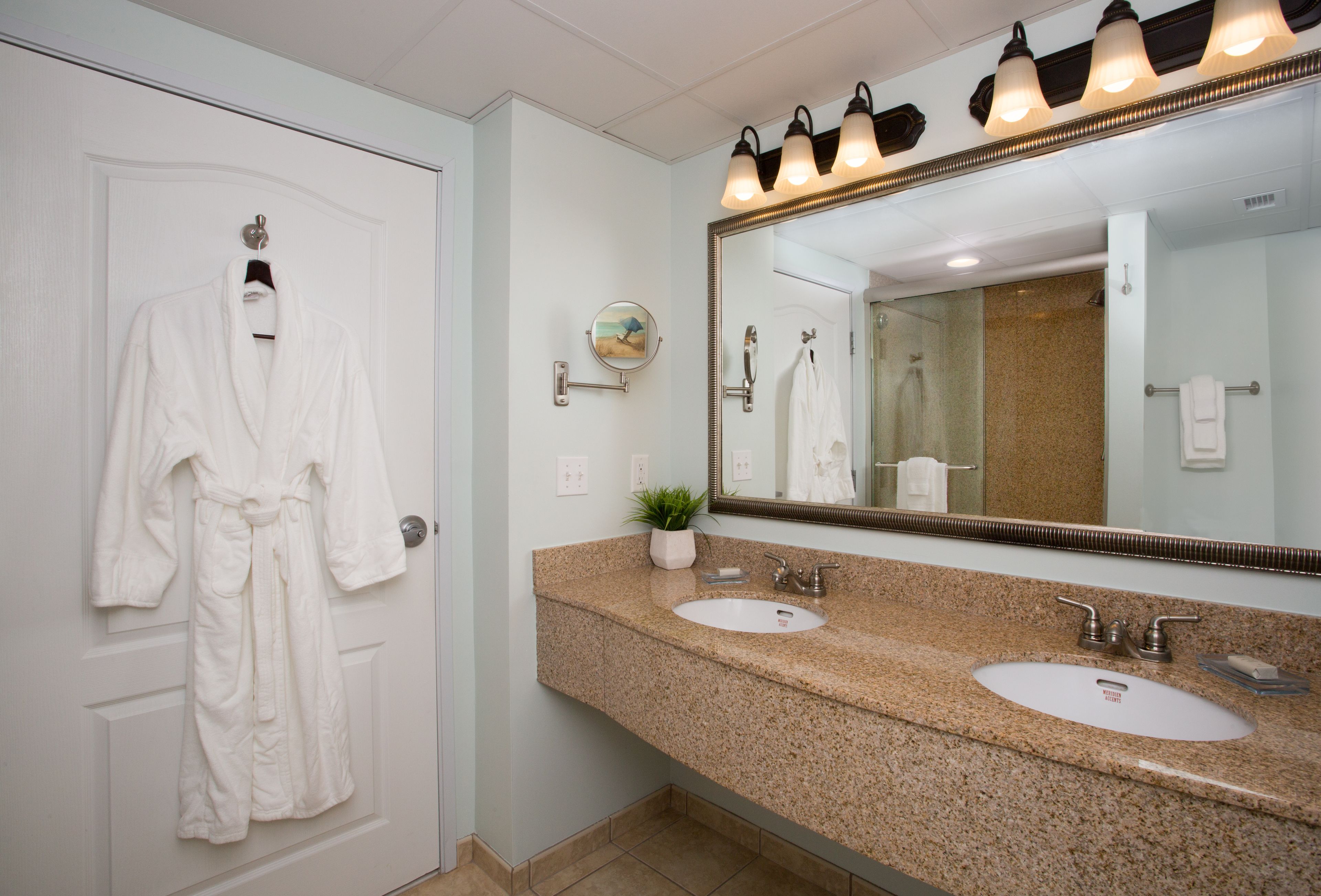 combined shower/bathtub, designer toiletries, hair dryer, bathrobes