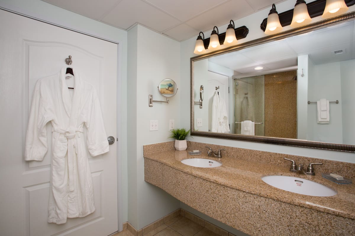 combined shower/bathtub, designer toiletries, hair dryer, bathrobes