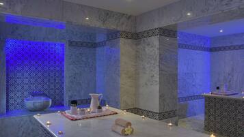 Relax in a serene spa area with a reception desk, reception counter, and comfortable seating.