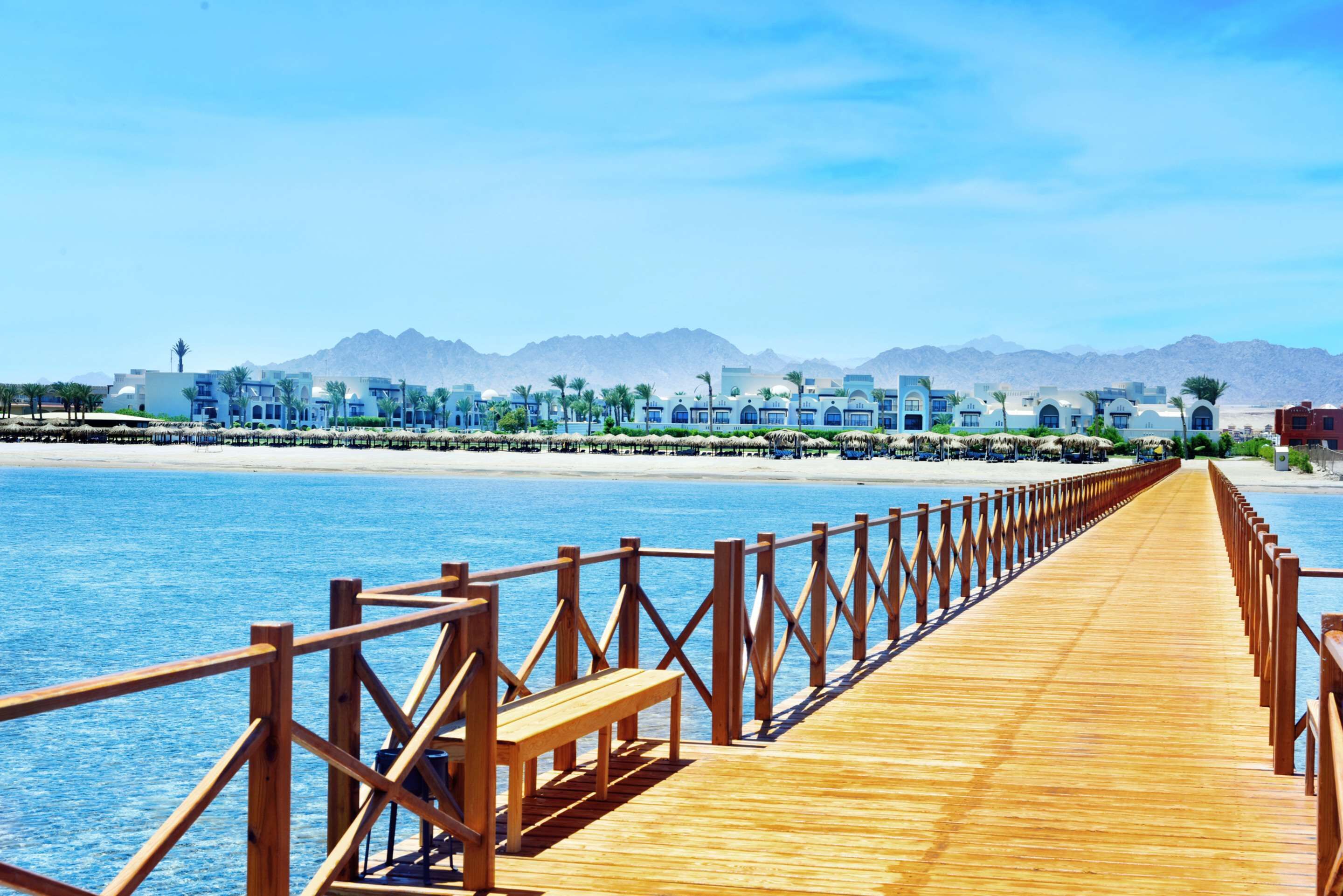 on the beach, white sand, sun-loungers, beach umbrellas