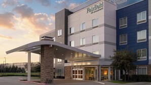A Fairfield by Marriott hotel with a modern design, featuring a prominent entrance and a covered outdoor area. - Fairfield Inn & Suites Dallas West/i-30 (Dallas)