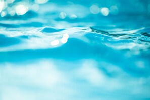 A close-up of water with light reflections.