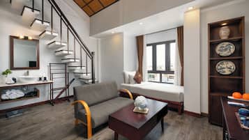 Family Duplex, Courtyard View | Living room | LCD TV, books