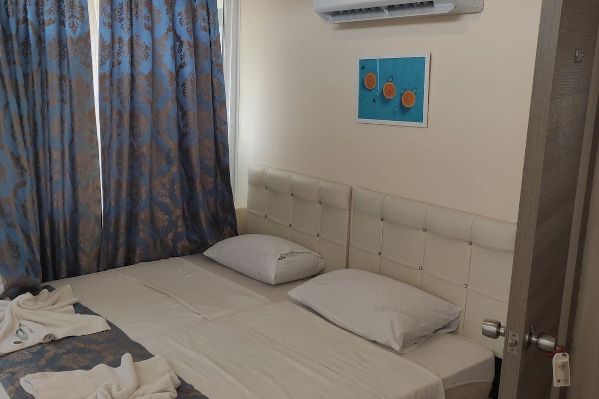 Chambre Ăconomique, 2 lits une place, vue ville | 1 chambre, coffres-forts dans les chambres, Wi-Fi gratuit, draps fournis