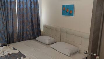 Economy Room, 2 Single Beds, City View | In-room safe, free WiFi, bed sheets