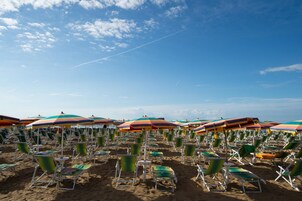 White sand, sun loungers, beach umbrellas