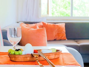 Comfort Apartment, Non Smoking, Garden View | Living area | 40-inch TV with satellite channels