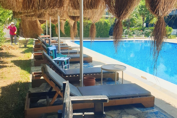 Outdoor pool, pool umbrellas, pool loungers