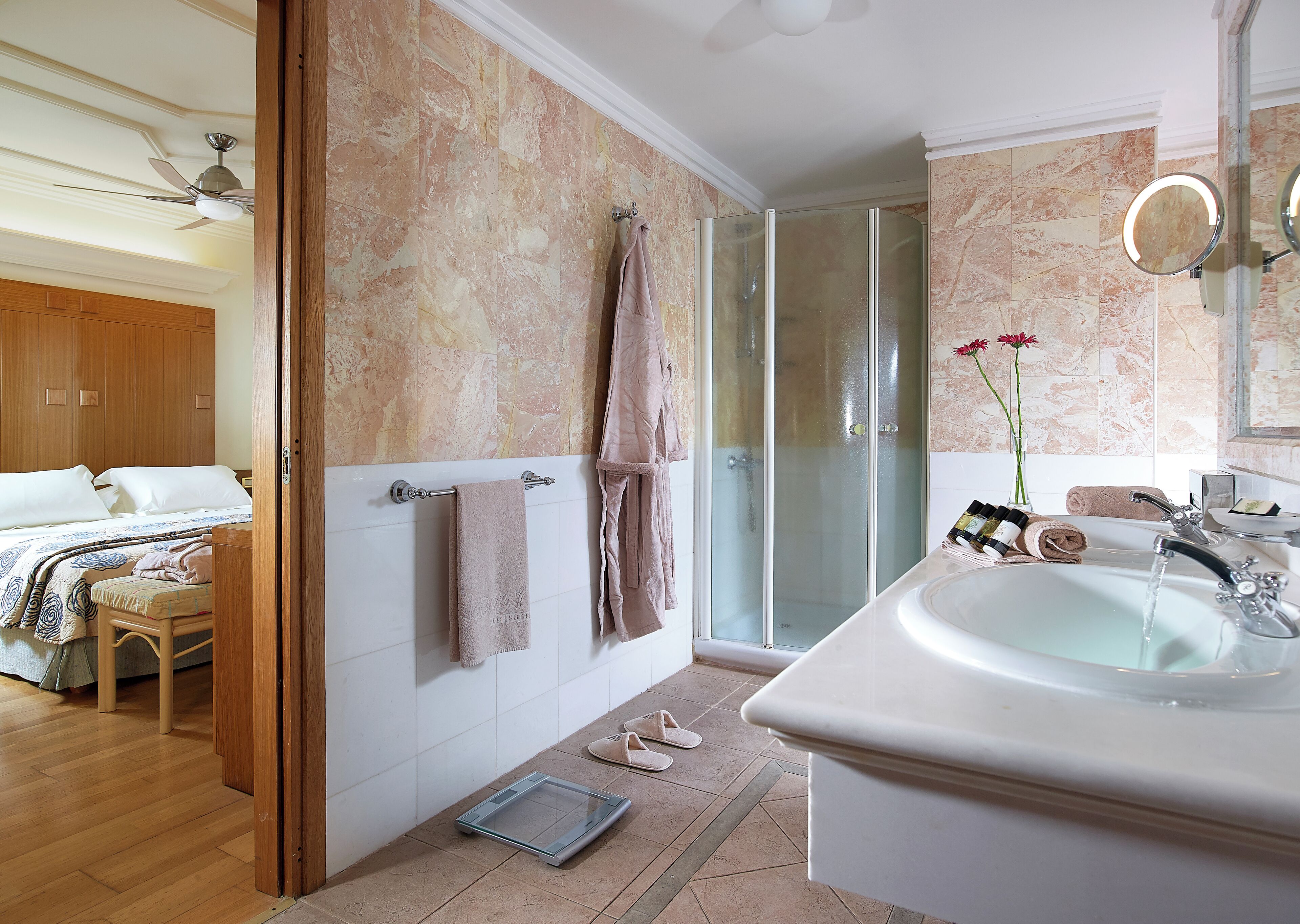 knossos suite sharing pool | bathroom | bathtub, free toiletries, hair dryer, slippers