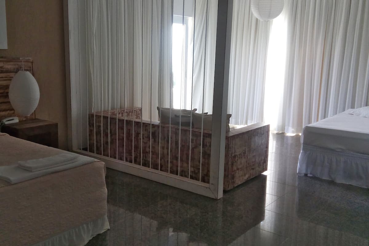 Luxury Suite, Sea View | Minibar, individually decorated, desk, blackout curtains