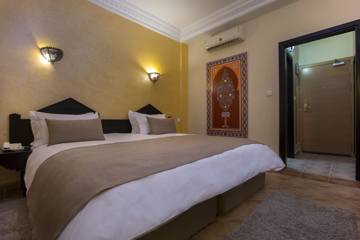 standard double room, pool view | premium bedding, in-room safe, desk, blackout curtains