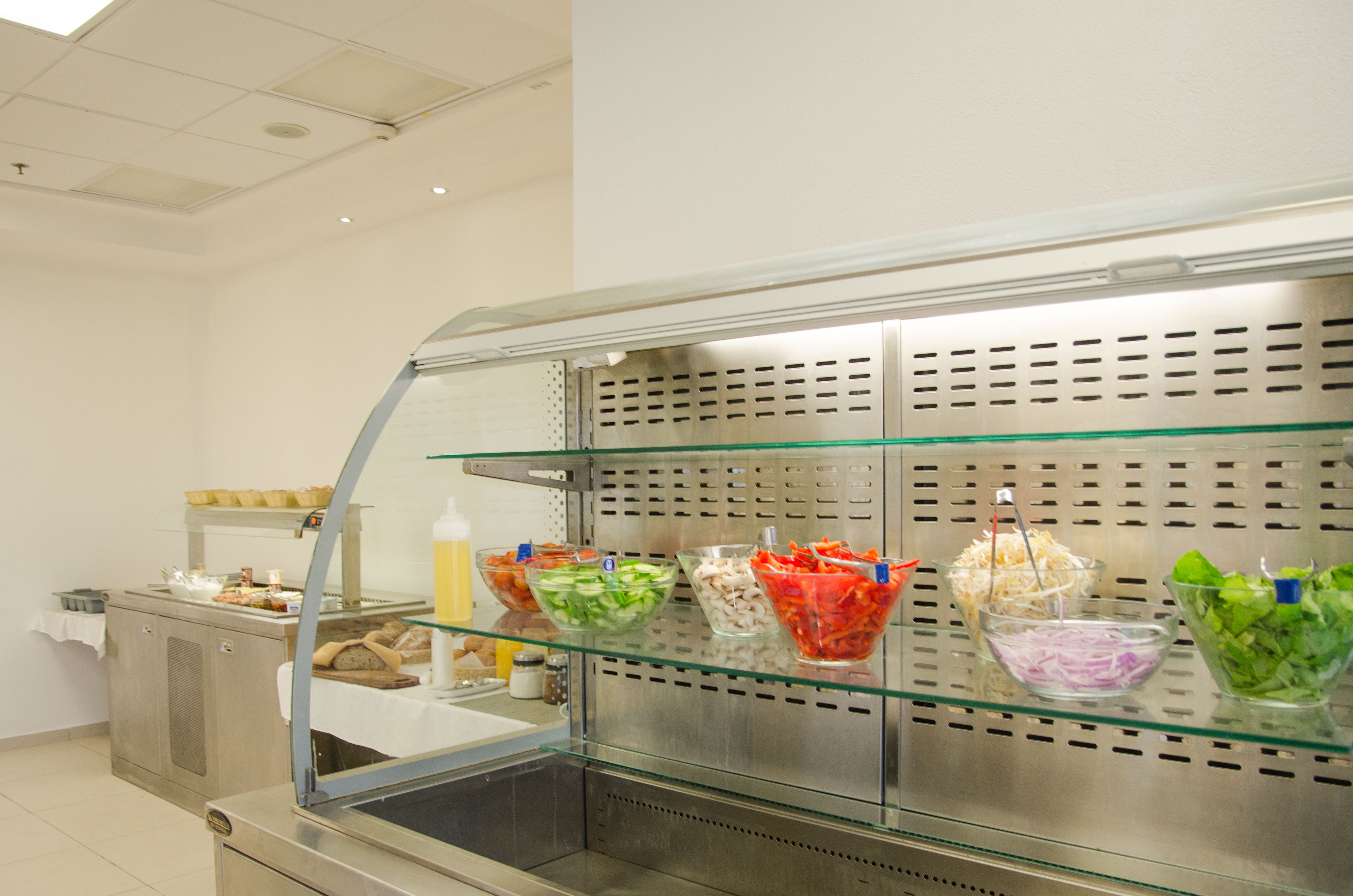 A buffet area with various food bowls on display.