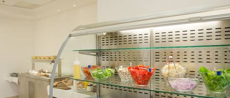 A buffet area with various food bowls on display.