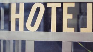 A hotel sign with the word "HOTEL" in large letters.