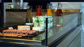 A display case with various food items and condiments.