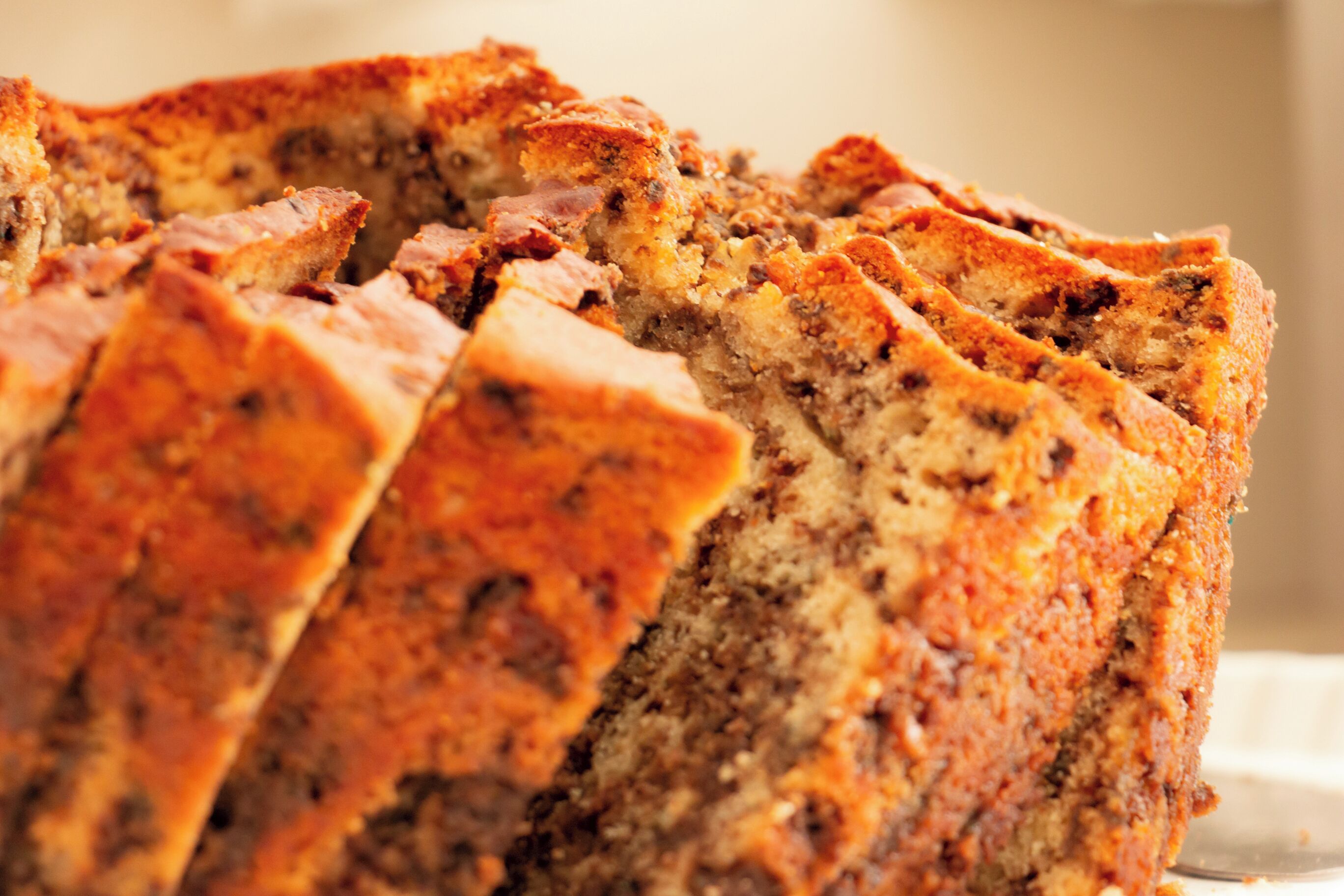 A loaf of bread with visible seeds and a golden-brown crust.