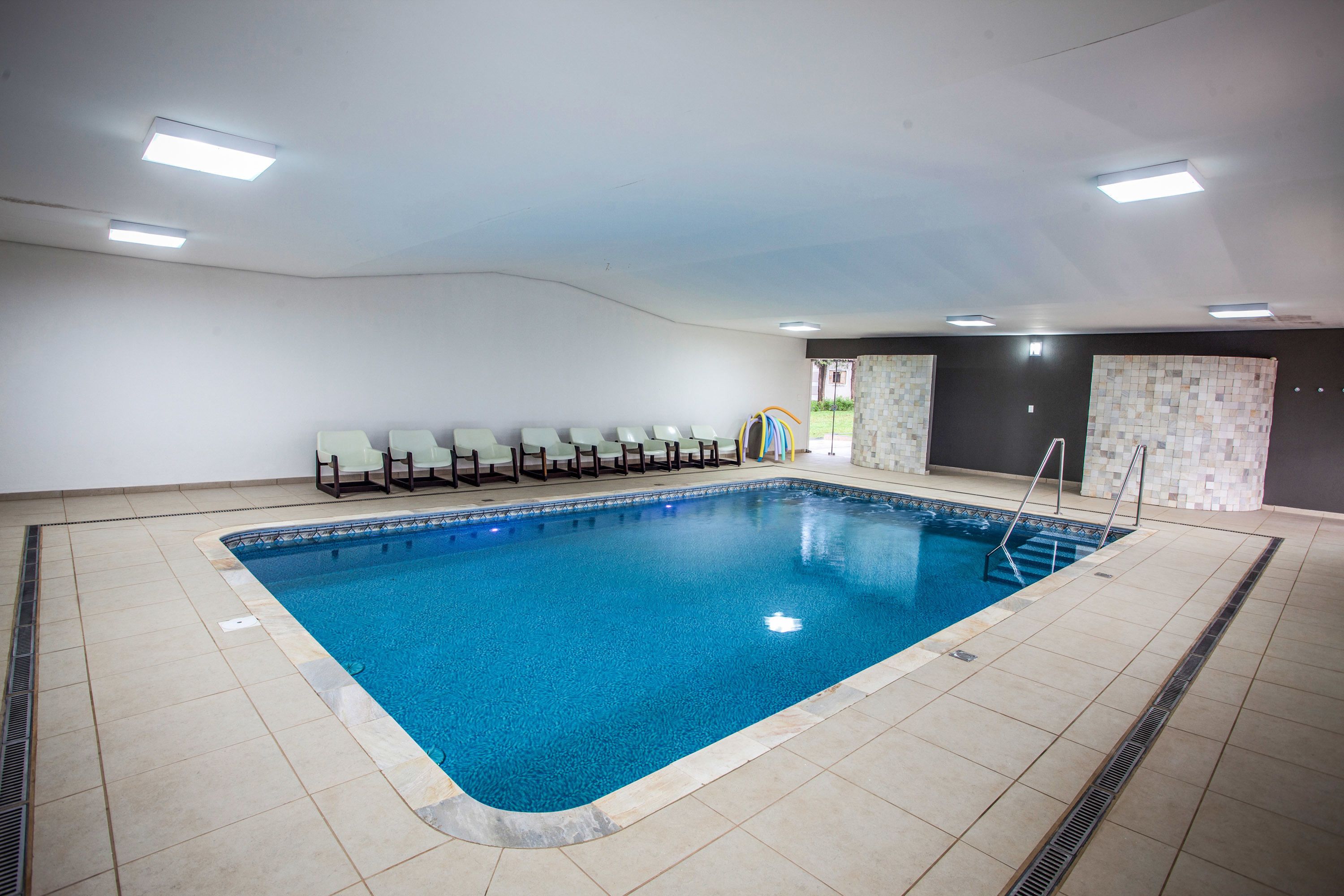 indoor pool, outdoor pool, pool loungers