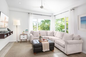 Luxury Apartment, 1 Bedroom | Living area | Flat-screen TV, iPad - The Oasis at Grace Bay (Providenciales)