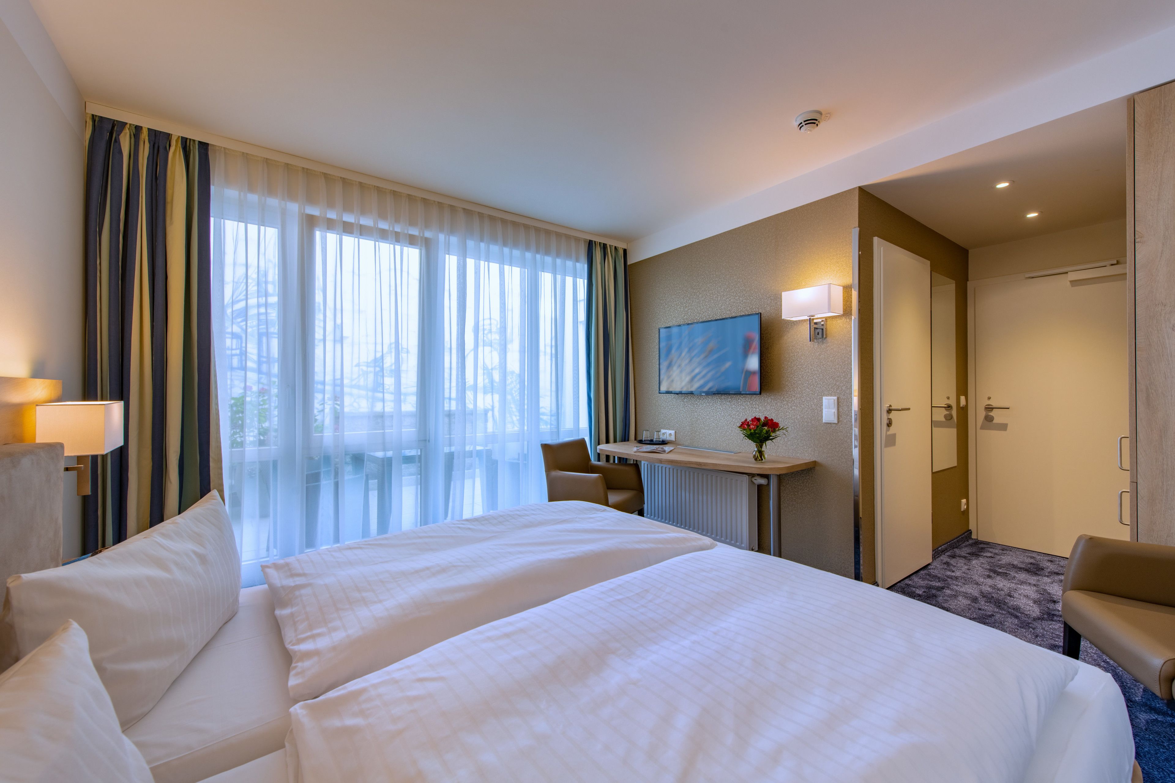 Desk, laptop workspace, free WiFi, bed sheets